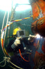 underwater welder welding a ship propeller